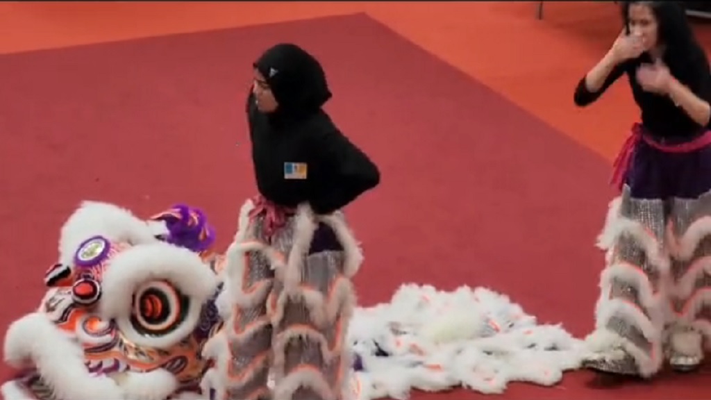 Malaysian girl with hijab goes viral for lion dance performance
