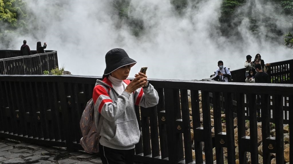 Local tourists visit a hot spring at the Thermal Valley in Taipei