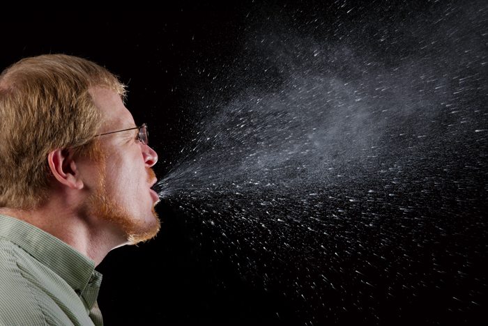 Science Reveals How Far Your Germs Travel Every Time You Sneeze