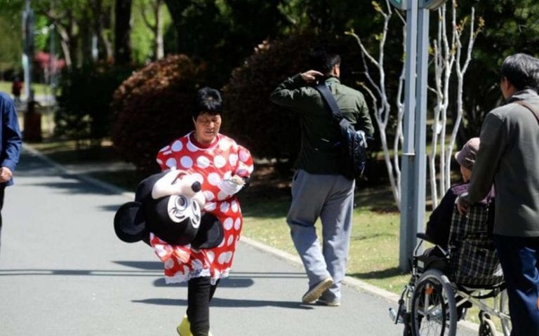 Chinese Grandma Wears a Minnie Mouse Costume for the Most Heartbreaking Reason