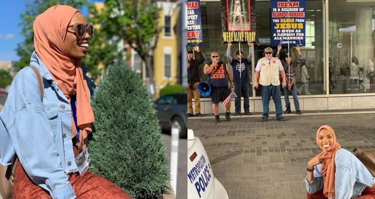 Badass Woman Poses In Front of Anti-Muslim Protesters for One Epic Photo