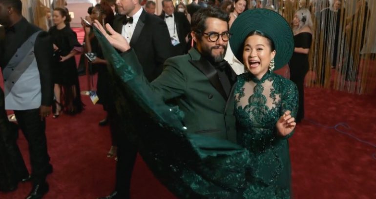 Vietnamese American actor Kelly Marie Tran arrives to the Oscars wearing a green ao dai