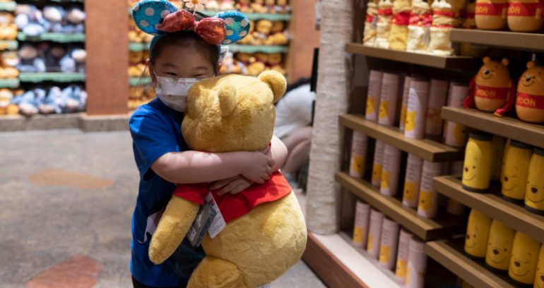 Disney Store Japan sells merch featuring Winnie the Pooh holding up blank white paper
