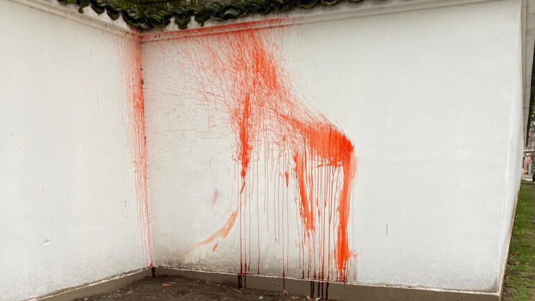 Men in clown wigs splatter fake blood onto walls of Vancouver’s Chinese garden