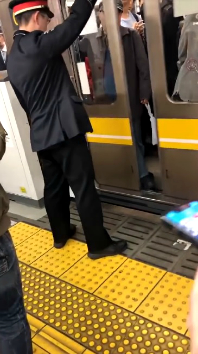 An elderly Japanese commuter who managed to stop a train has gone viral on social media.